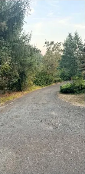 The same driveway before: loose gravel