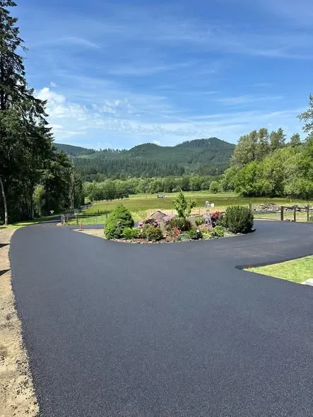 Paved turnaround with a planted island and valley view